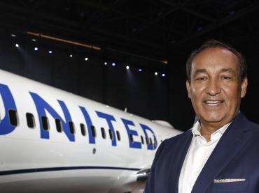 Smiling Oscar Munoz With UNITED Airlines Jet In The Background