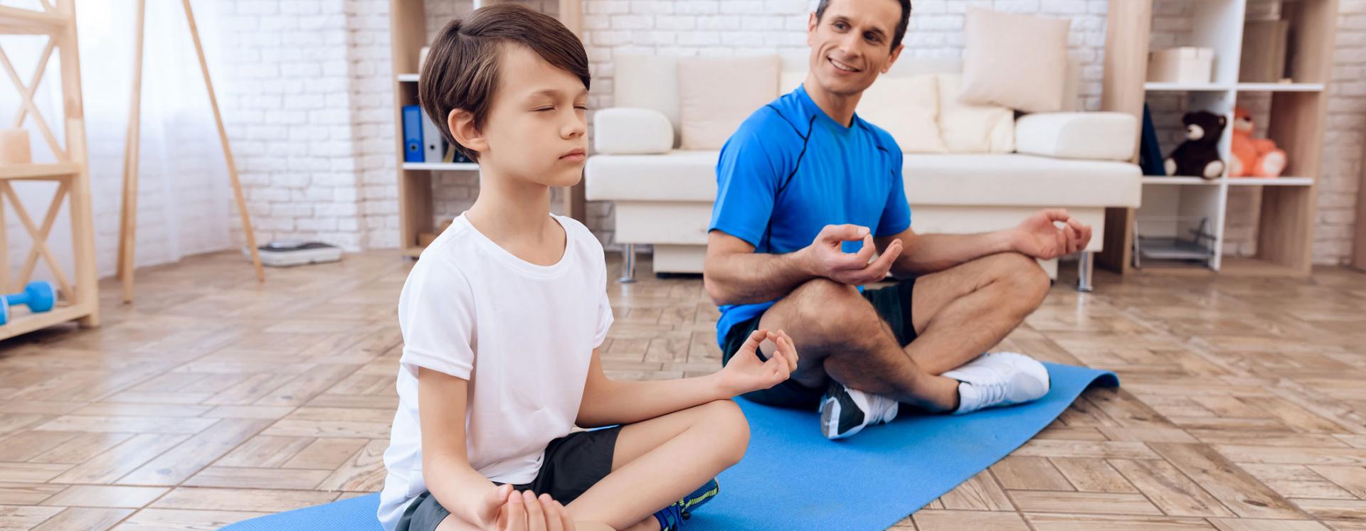 Father And Son Performing Yoga Together