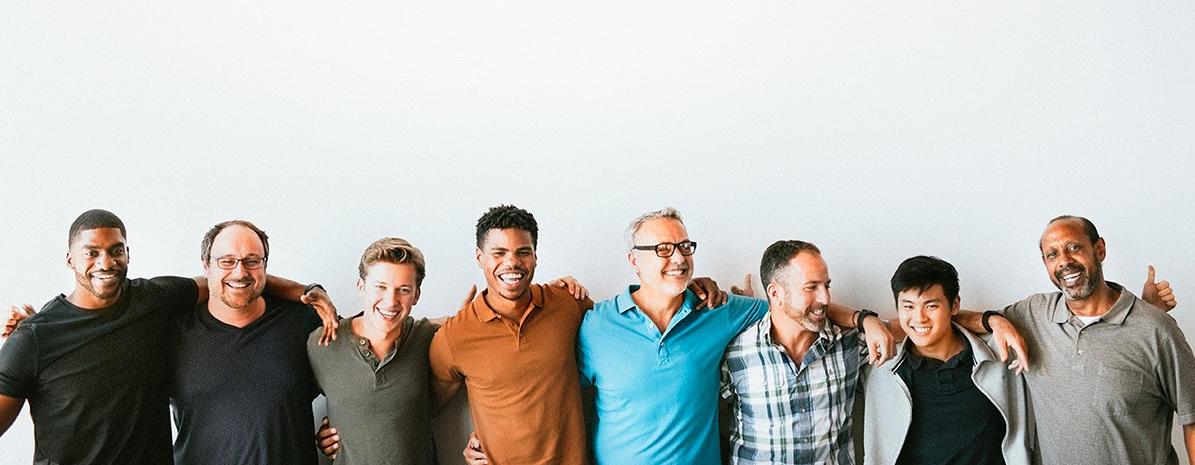 men of different ages and races standing in a-line