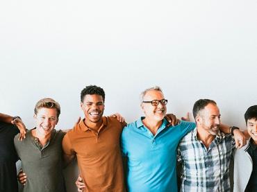 men of different ages and races standing in a-line