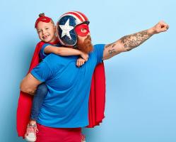 powerful-dad-in-protective-helmet-with-child-holding-on-his-back