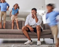 stress-burnout-father-with-active-kids-running