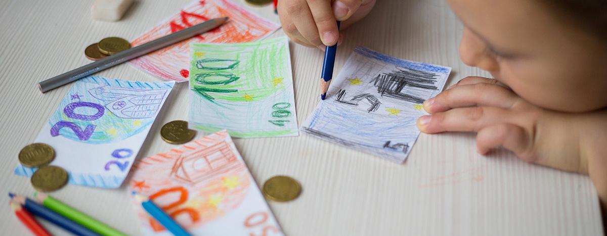 little-girl-draws-money-banknotes-with-colored-pen