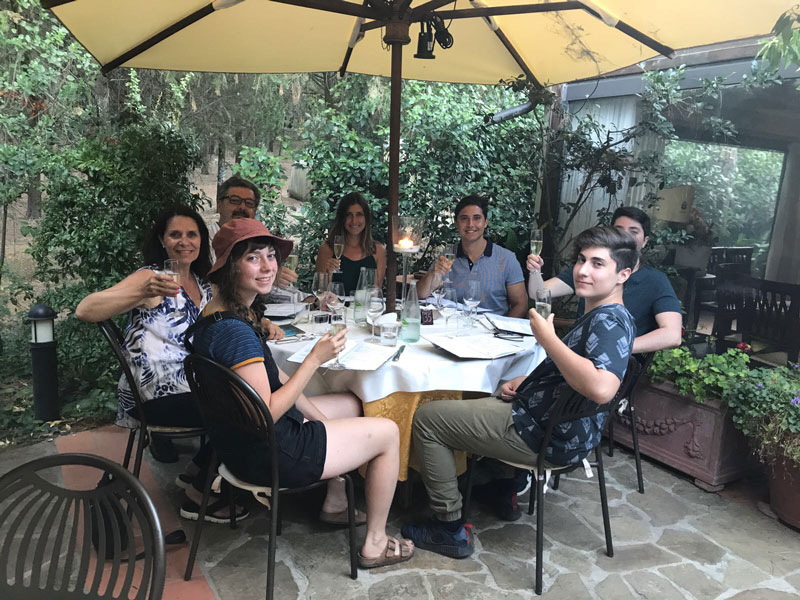 Aldo Cundari Family Enjoying Meal On Veranda