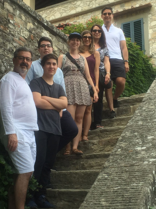 Aldo Cundari Family Posing For Photo On Steps In Tuscany Italy