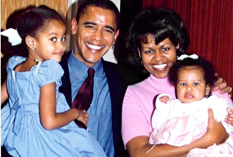 Young Barrack And Michelle Obama Holding Their Daughters In Arms