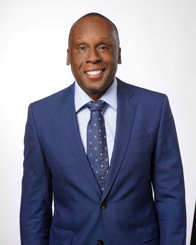 Bruny Surin Corporate Photo in Business Suit