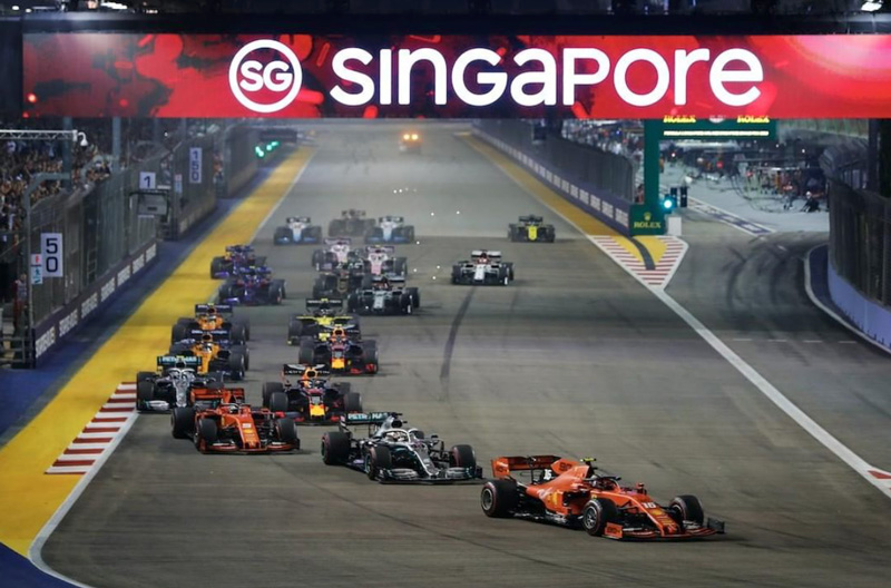 Singapore Grand Prix With Formula 1 Cars On Race Track At Night