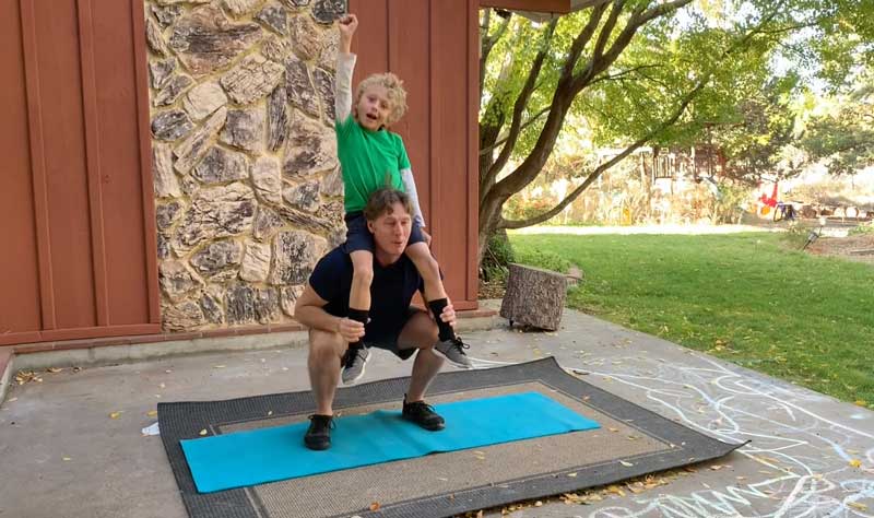 Sorren Harrison Of Fit Daddy 365 Doing 5 Shoulder Style Squats With Son