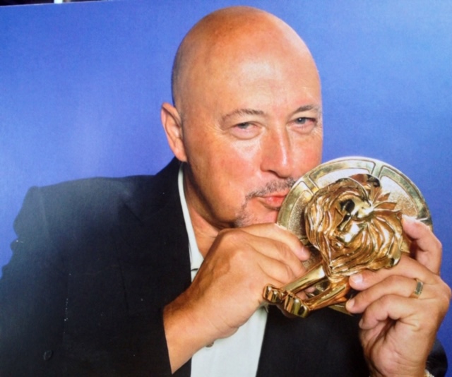 Frank Palmer Holding And Kissing Cannes Lions Advertising Award Trophy