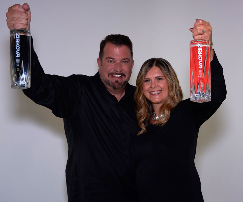 John Vellinga With Wife Katherine Each Holding Up Zirkova Vodka Bottles