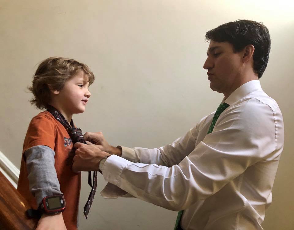 Justin Trudeau Adjusting Tie Of Son Hadrien