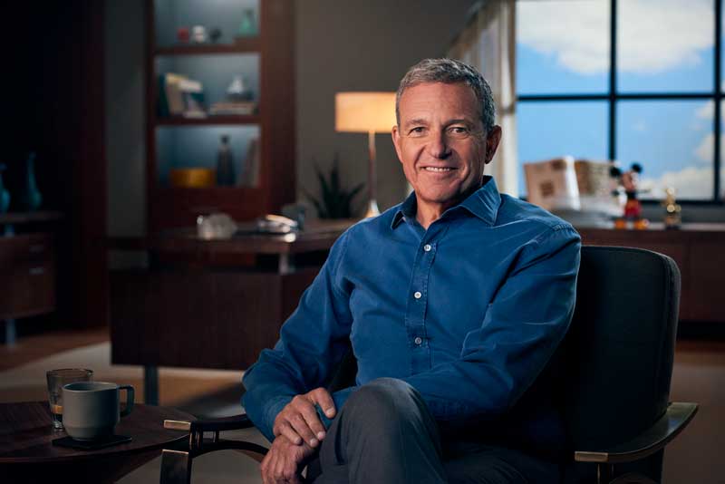 Walt Disney CEO Bob Iger Sitting On Chair in Office Smiling