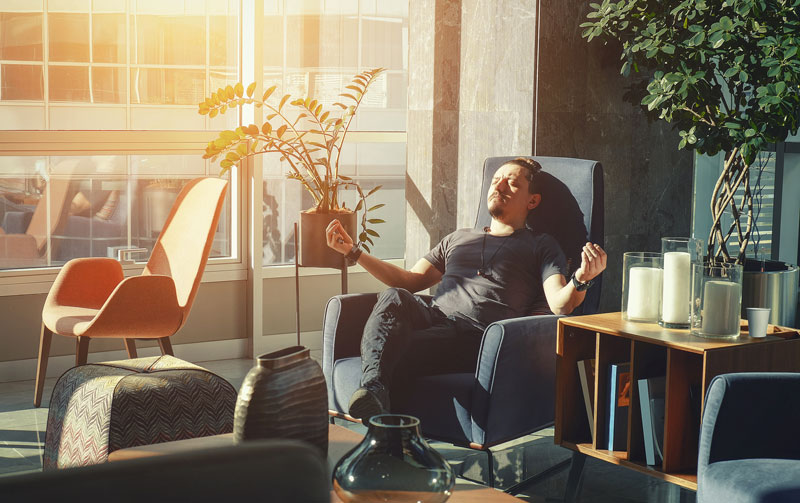 Man Sitting In Office Chair Meditating