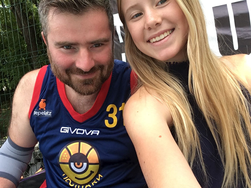 Mikhail Pimenov With His Daughter Alisa At Basketball Game