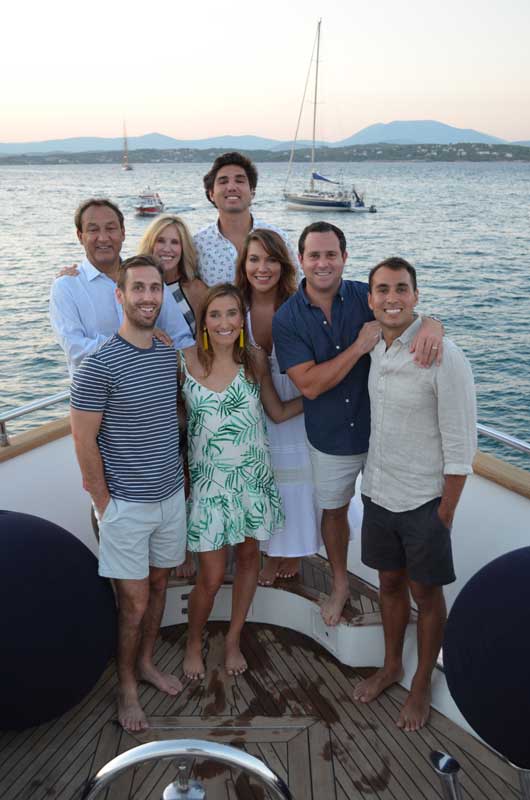 Oscar Munoz Family Posing For Photo On Boat On Water