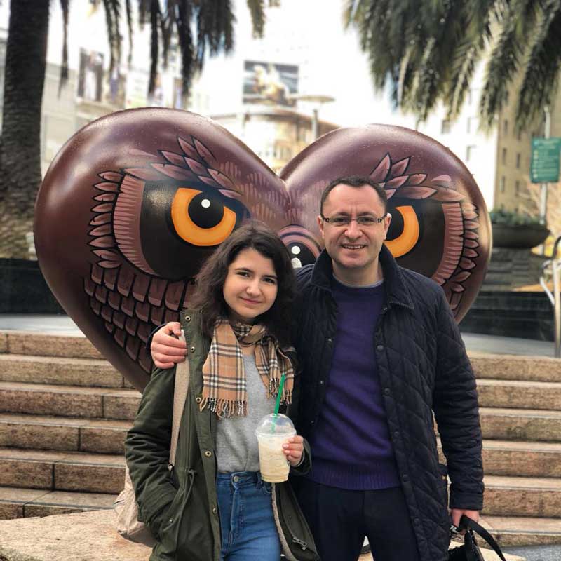 Vasyl Myroshnychenko With Arm Around His Daughter