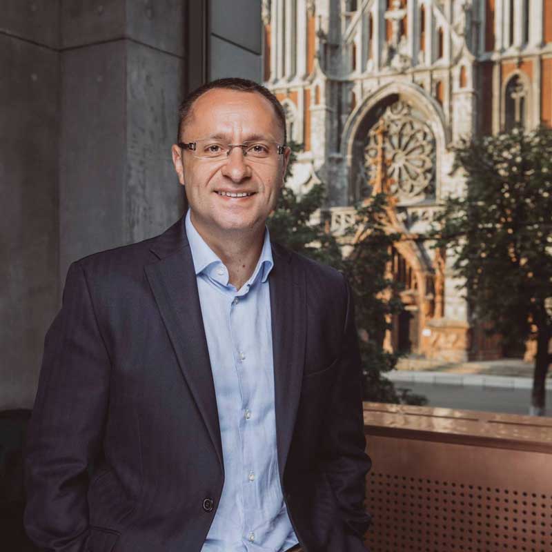 Vasyl Myroshnychenko Corporate Photo With Church In Background