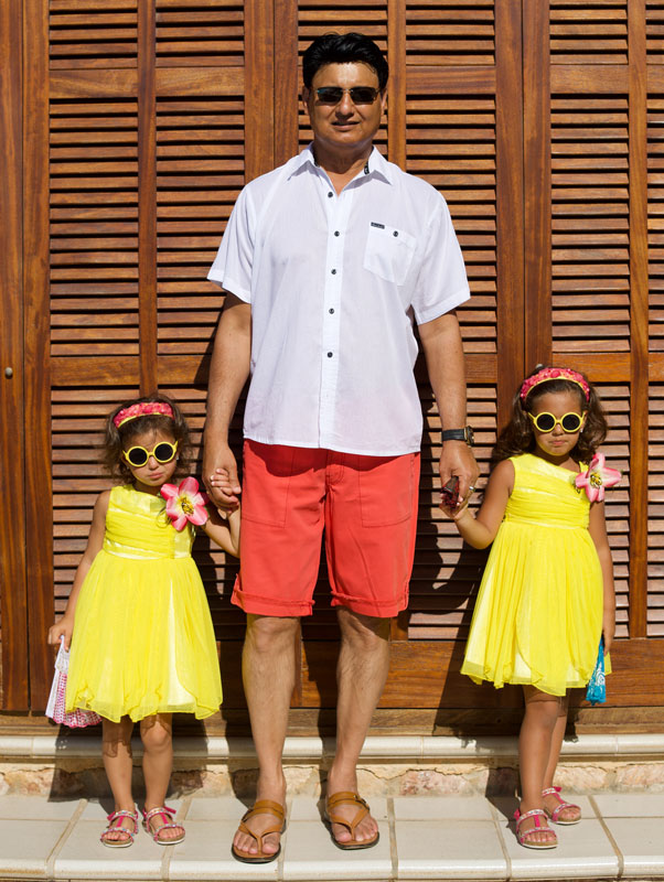 Mohammad Zahoor Holding Hands Of His Twin Daughters